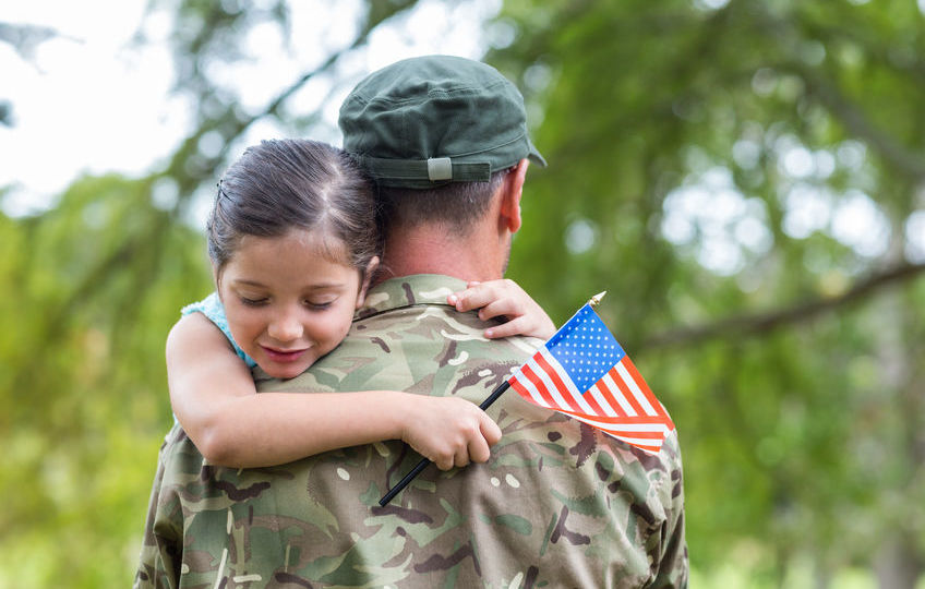 Soldier reunited with his daughter on a sunny day